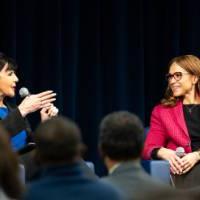 Melissa Harris-Perry, left, chats with President Mantella who has a microphone in her hand